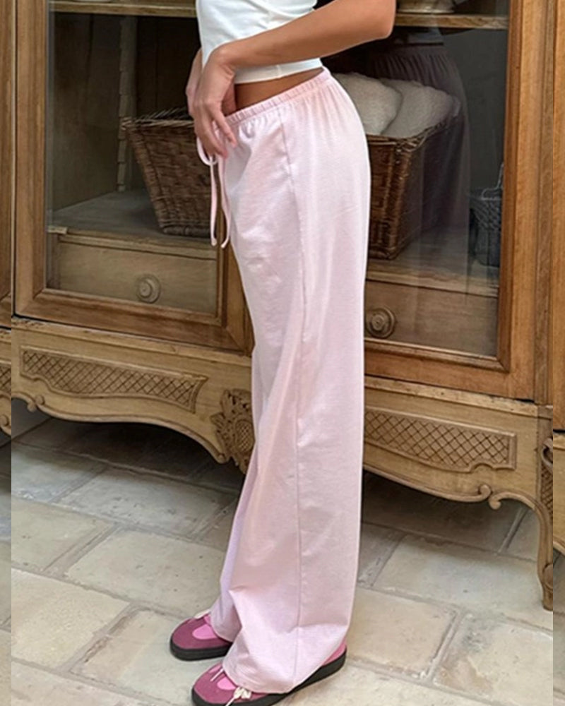 SLOUCHY STRIPED LACE-UP LOW-RISE DRAPED TROUSERS